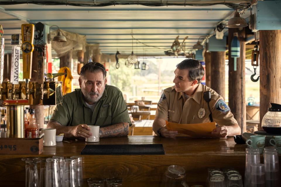 Anthony LaPaglia (left) as Sonny and Paul Schneider as Officer Andy in Netflix series "Florida Man," which shot in the Wilmington area in 2021.