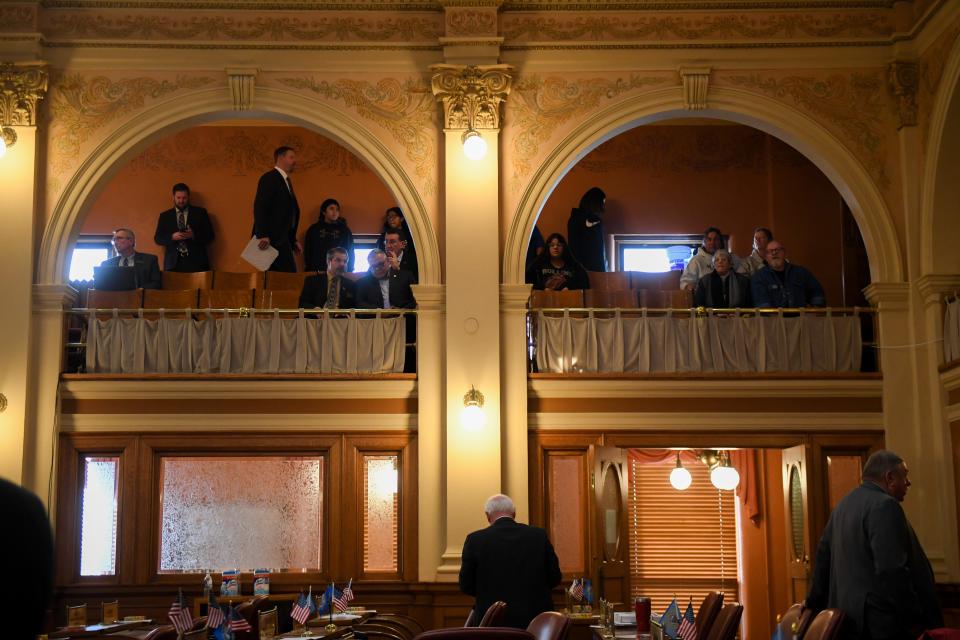 Legislators begin to enter the House of Representatives on Tuesday, Dec. 5, 2023 at the South Dakota State Capitol in Pierre.