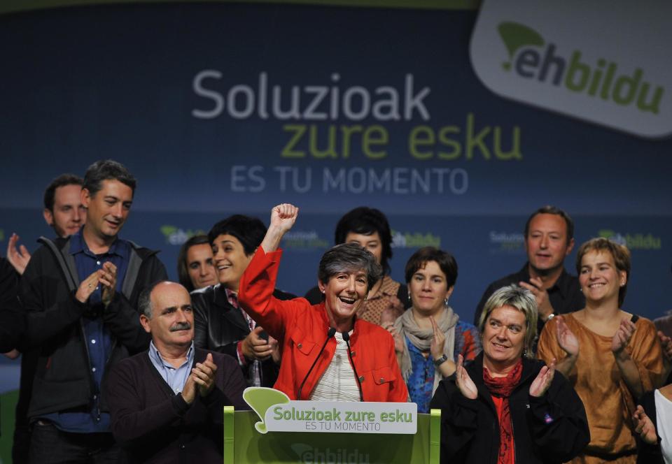 Laura Mintegi, center, leader of Euskal Herria Bildu, the new pro independence Basque Party, celebrates with supporters in Bilbao, northern Spain, Sunday Oct. 21, 2012. Almost 4.5 million people went to the polls Sunday in regional elections in Spain's turbulent Basque region and in northwestern Galicia. In the Basque region the Basque Nationalist Party _ PNV _ took 27 seats while the separatist Bildu party claimed 21, giving pro-independence candidates their second-largest majority in 34 years of democracy. (AP Photo/Alvaro Barrientos)