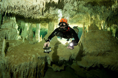 A scuba diver measures the length of Sac Aktun underwater cave system as part of the Gran Acuifero Maya Project near Tulum, in Quintana Roo state, Mexico January 24, 2014. Picture taken January 24, 2014. Herbert Mayrl/Courtesy Gran Acuifero Maya Project (GAM)/Handout via REUTERS