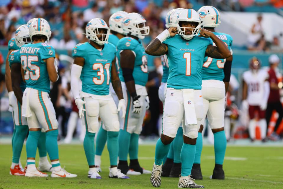 Aug 17, 2024; Miami Gardens, Florida, USA; Miami Dolphins quarterback Tua Tagovailoa (1) looks on from the field against the Washington Commanders during the first quarter of a preseason game at Hard Rock Stadium. Mandatory Credit: Sam Navarro-USA TODAY Sports