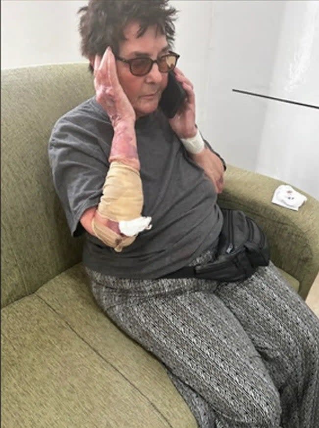 Julie Lenkoff, 80, is pictured here while she was stranded on an African island and on the phone with her family in the US after a South Carolina family took care of her.