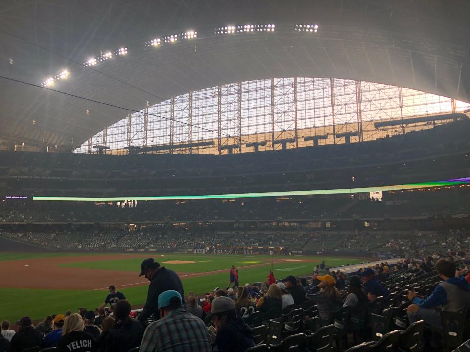 Smoke from a fire at a recycling facility on Milwaukee's near south side makes its way into American Family Field during a 2021 ballgame.