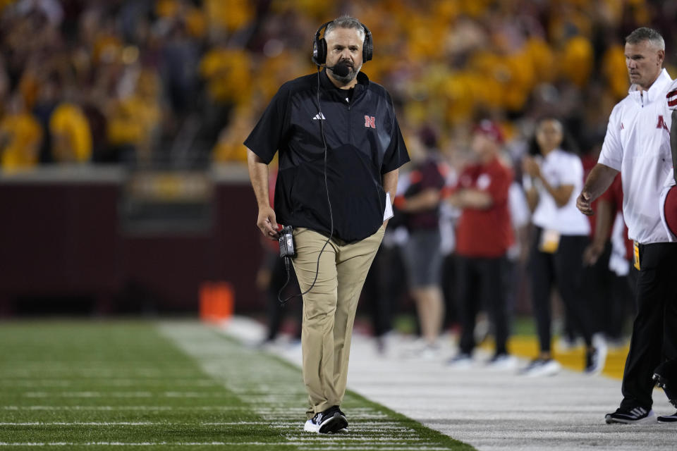 Nebraska coach Matt Rhule walks on the field during the first half of the team's NCAA college football game against Minnesota, Thursday, Aug. 31, 2023, in Minneapolis. (AP Photo/Abbie Parr)