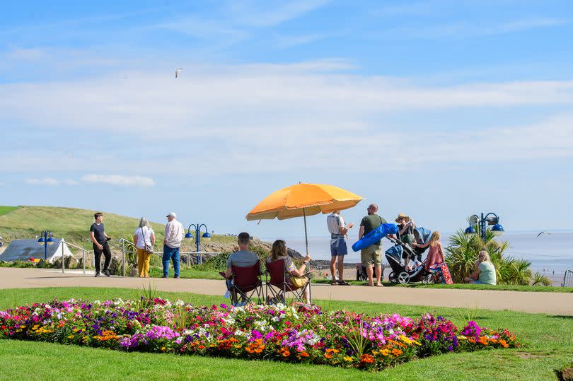 People enjoying the sunshine at Barry Island last year