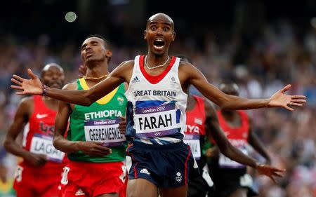 Britain's Mo Farah reacts as he wins the men's 5000m final at the London 2012 Olympic Games at the Olympic Stadium in Britain August 11, 2012. REUTERS/Lucy Nicholson