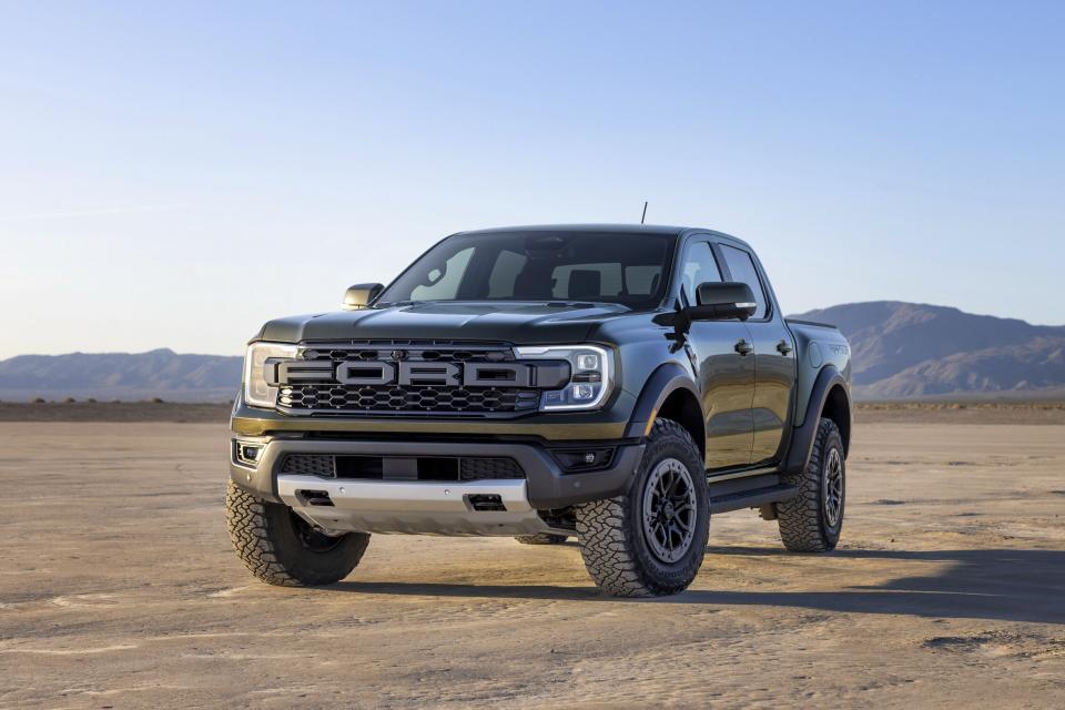 This photo provided by Ford shows the 2024 Ford Ranger Raptor. Dedicated to off-road performance, the Raptor comes with a 405-horsepower V6, all-terrain tires, and a special suspension tuned for high-speed driving in the dirt. (Ford Motor Co. via AP)