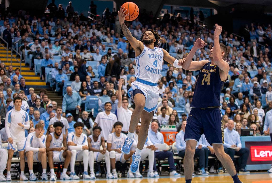 North Carolina’s R.J. Davis (4) drives to the basket against Notre Dame’s Nate Laszewski (14) during the second half on Saturday, January 7, 2023 at the Smith Center in Chapel Hill, N.C.