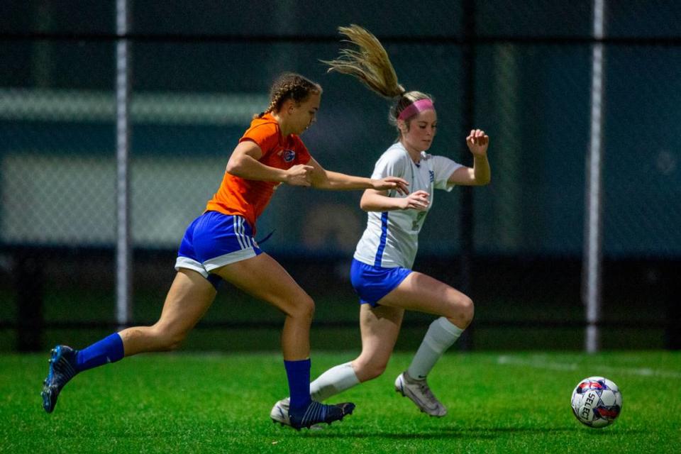 Gulfport’s Abigail Badurak and Ocean Springs’ Megan Hughes fight for the ball during the 6A South State Championship game in Gulfport on Tuesday, Jan. 31, 2023.