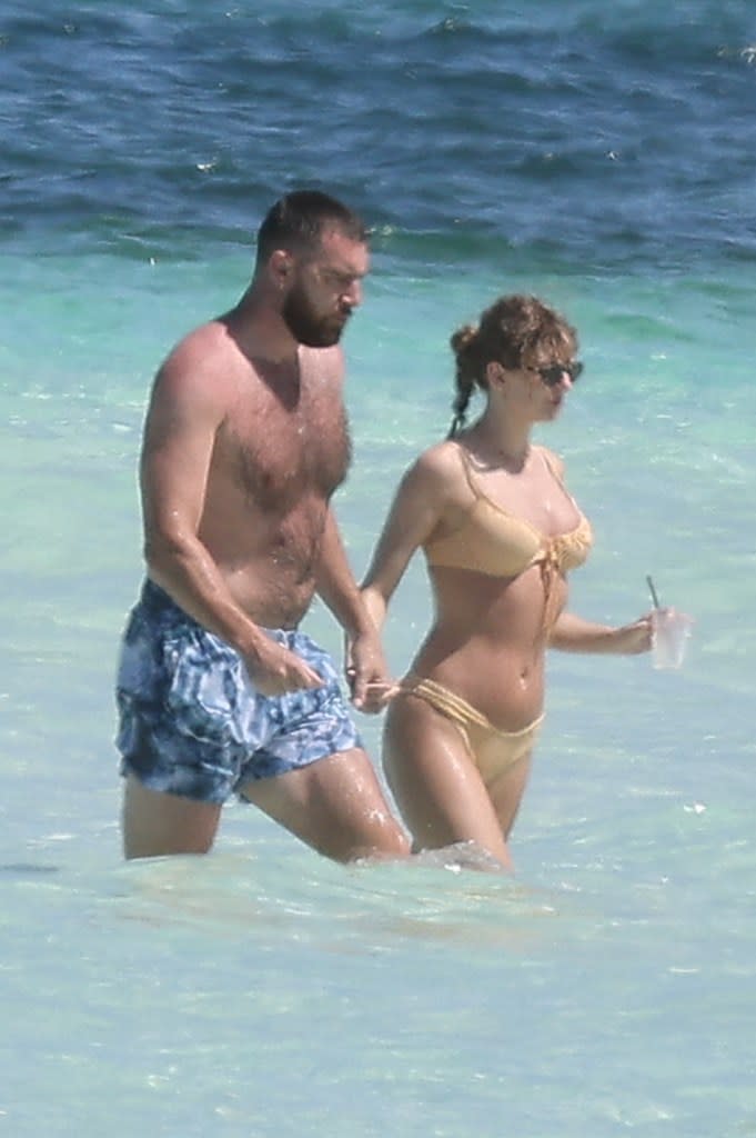 Travis Kelce and Taylor Swift take in the shore while on vacation on Harbour Island, Bahamas, on March 21, 2024. Mega/BackGrid