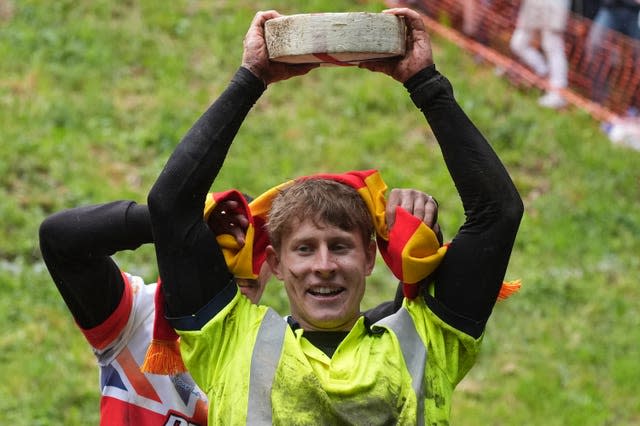 Tom Kopke celebrates winning the 1st men's downhill race (Jacob King/PA)