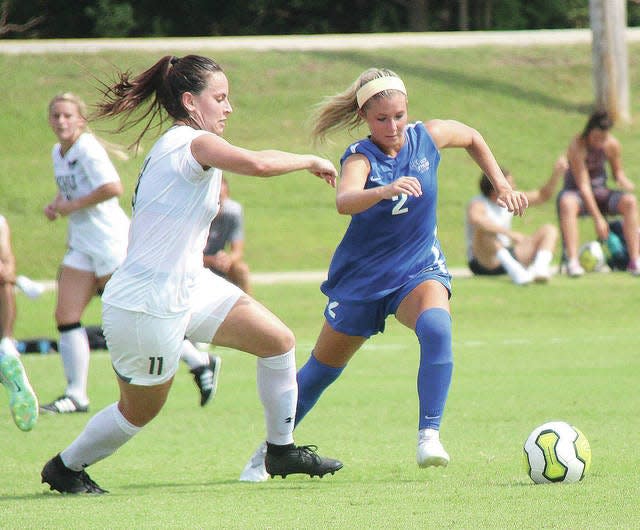 Oklahoma Wesleyan University’s Laura Maria, left, hustles to the ball during a women’s soccer battle against Oklahoma City. in a previous season Mike Tupa/Examiner-Enterprise