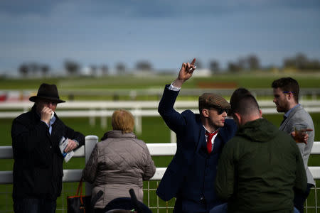 Punters enjoy the horse racing at Fairyhouse Racecourse in Ratoath, Ireland, April 17, 2017. REUTERS/Clodagh Kilcoyne