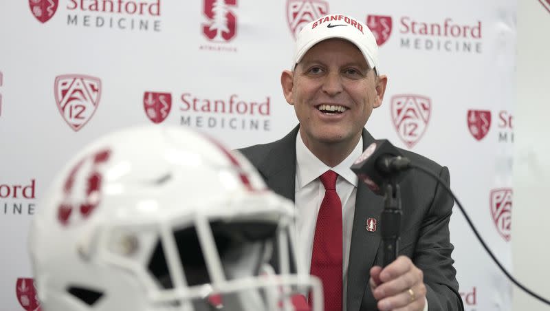 Troy Taylor smiles as he speaks after being introduced as the new head football coach at Stanford during a news conference, Monday, Dec. 12, 2022, in Stanford, Calif. The former Utah offensive coordinator has taken over the Cardinal program after David Shaw resigned following the 2022 season.