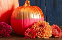 <p>Play with neon hues and metallics for a two-tone pumpkin that makes a bright statement. Brush or dip one half and let dry. Then tape off and color the other half.</p><p><a class="link " href="https://www.amazon.com/Jacquard-Lumiere-Metallic-Acrylic-Ounces-True/dp/B001DKJES0?tag=syn-yahoo-20&ascsubtag=%5Bartid%7C10055.g.1714%5Bsrc%7Cyahoo-us" rel="nofollow noopener" target="_blank" data-ylk="slk:SHOP PAINT;elm:context_link;itc:0;sec:content-canvas">SHOP PAINT</a><br></p>