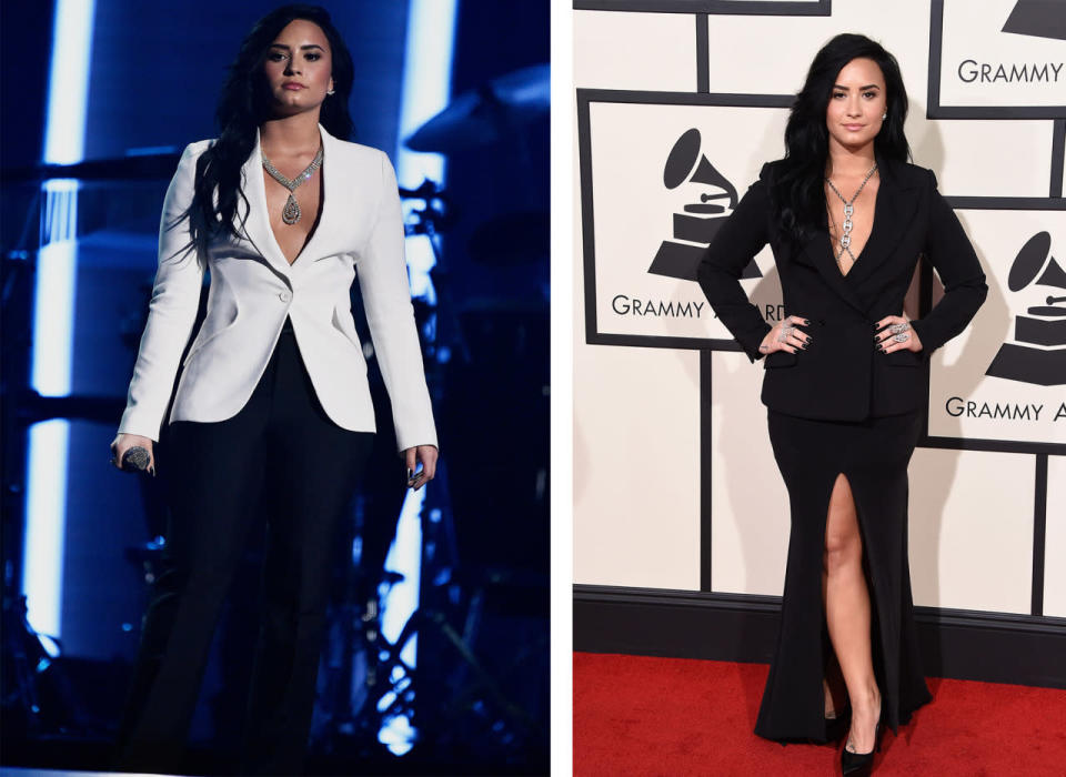 Demi Lovato in a white tuxedo jacket and big statement necklace onstage during the tribute to Lionel Richie; the singer on the red carpet in a black blazer and maxi skirt. (Getty Images)