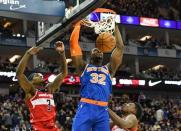 Jan 17, 2019; London, United Kingdom; New York Knicks forward Noah Vonleh (32) dunks over Washington Wizards guard Bradley Beal (3) during the third quarter at The O2 Arena. Mandatory Credit: Steve Flynn-USA TODAY Sports