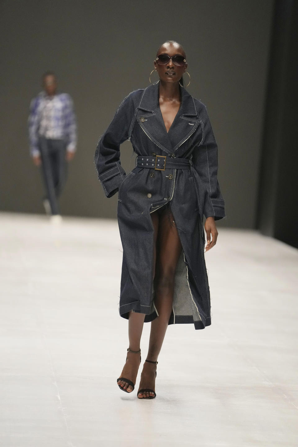 A model wears a creation by Abigail Ajobi during the Lagos Fashion Week in Lagos, Nigeria, Thursday, Oct. 26, 2023. Africa's fashion industry is rapidly growing to meet local and international demands but a lack of adequate investment still limits its full potential, UNESCO said Thursday in its new report released at this year's Lagos Fashion Week show. (AP Photo/Sunday Alamba)