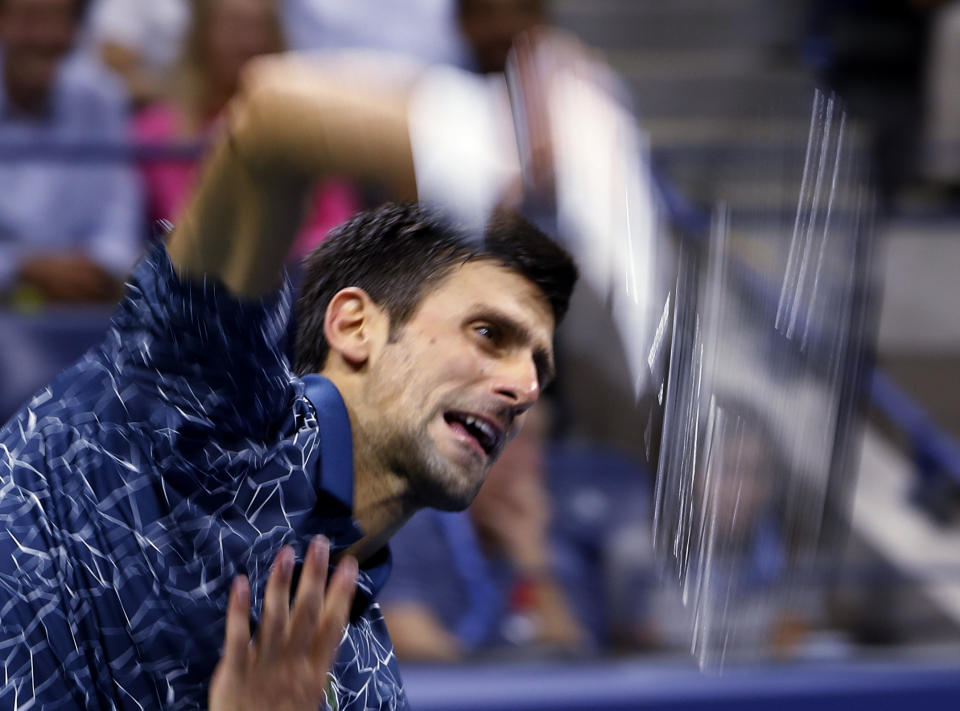 Novak Djokovic, of Serbia, serves to Kei Nishikori, of Japan, during the semifinals of the U.S. Open tennis tournament, Friday, Sept. 7, 2018, in New York. (AP Photo/Adam Hunger)