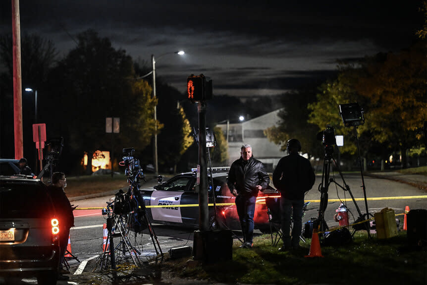 Police officers close the road after the mass shooting in lewiston maine