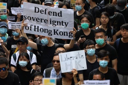 Hong Kong activists march to major international consulates in an attempt to rally foreign governments' support for their fight against a controversial extradition bill, in Hong Kong