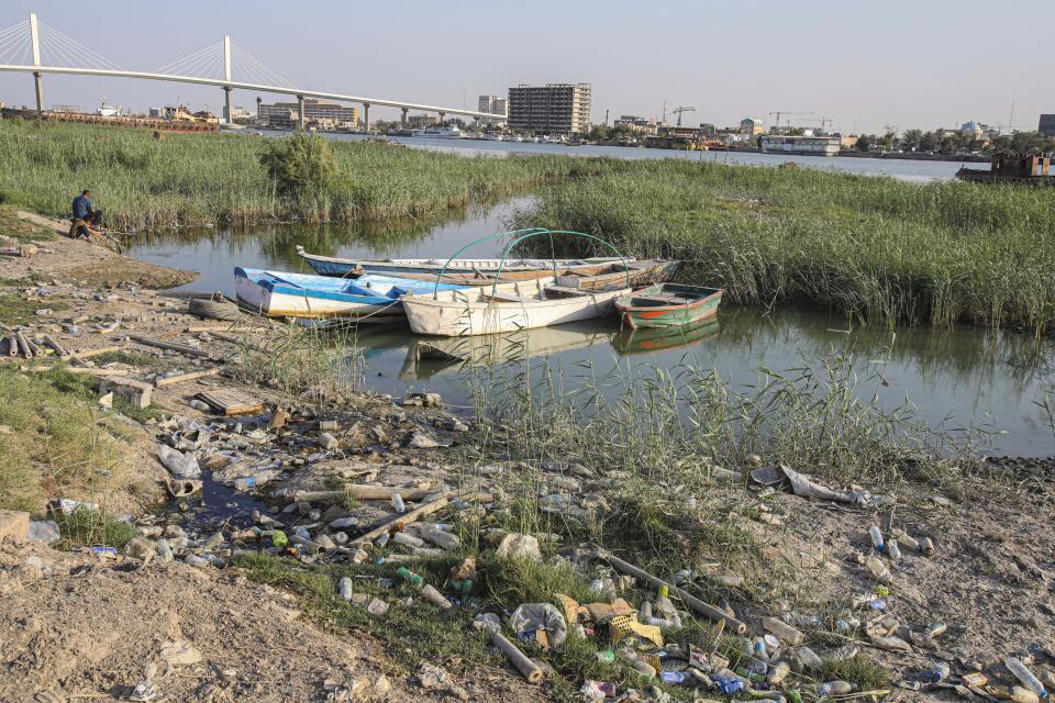 Fishing boats sit in the Shatt al-Arab waterway in Basra, Iraq on July 13, 2020. Iraq's Minister of Water Resources is sounding the alarm over looming water shortages if agreements are not forged with neighboring Turkey for its irrigation and dam projects, which he said has decreased river inflows to Iraq's parched plains. (AP Photo/Nabil al-Jurani)