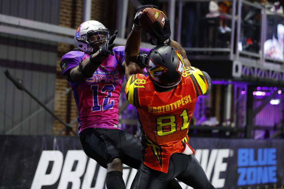 Terrell Owens of the Zappers catches a touchdown against Julian Charles of the Shoulda Been Stars in a Fan Controlled Football League game on April 16, 2022 in Atlanta. (Todd Kirkland/Fan Controlled Football/Getty Images)