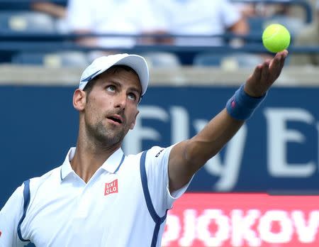 Jul 27, 2016; Toronto, Ontario, Canada; Novak Djokovic of Serbia serves against Gilles Muller of Luxembourg on day three of the Rogers Cup tennis tournament at Aviva Centre. Mandatory Credit: Dan Hamilton-USA TODAY Sports