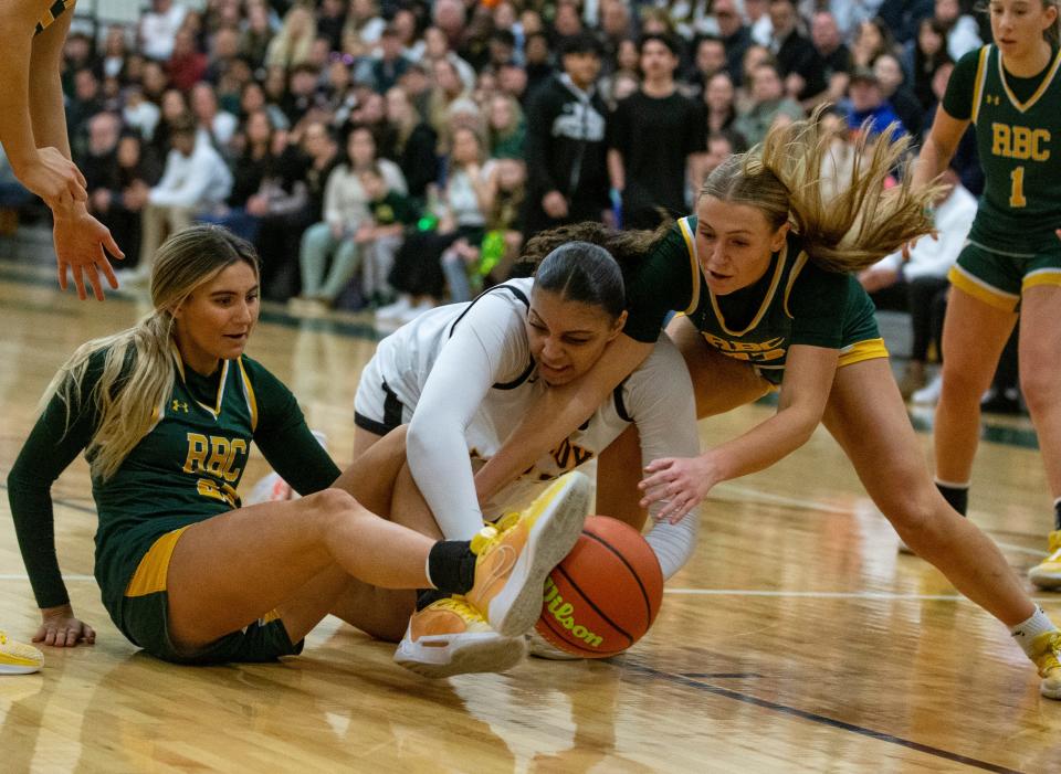 SJV’s Stella Lockhart (center) and RBC’s Daniella Maletsky and Christina Liggio fight for the ball. St John Vianney vs Red Bank Catholic in NJSIAA state tournament semifinal.   
Red Bank, NJ
Thursday, February 29, 2024