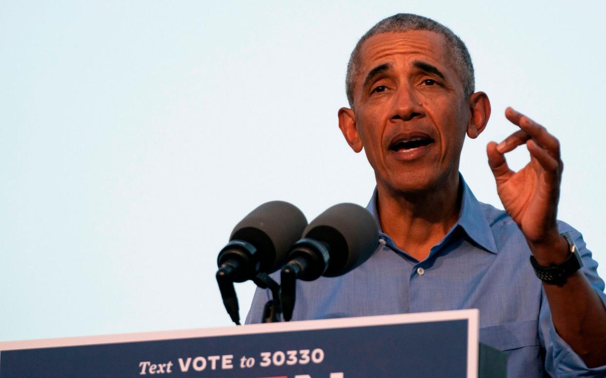 Barack Obama addresses Biden-Harris supporters during a drive-in rally in Philadelphia, Pennsylvania - AFP