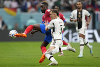 Costa Rica's Joel Campbell, left, and Germany's David Raum challenge for the ball during the World Cup group E soccer match between Costa Rica and Germany at the Al Bayt Stadium in Al Khor , Qatar, Thursday, Dec. 1, 2022. (AP Photo/Martin Meissner)