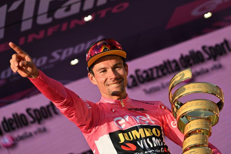 JumboVismas Slovenian rider Primoz Roglic celebrates on the podium with the races winners Trofeo Senza Fine Endless Trophy after winning the Giro dItalia 2023 cycling race in Rome on May 28 2023 Photo by Alberto PIZZOLI  AFP Photo by ALBERTO PIZZOLIAFP via Getty Images