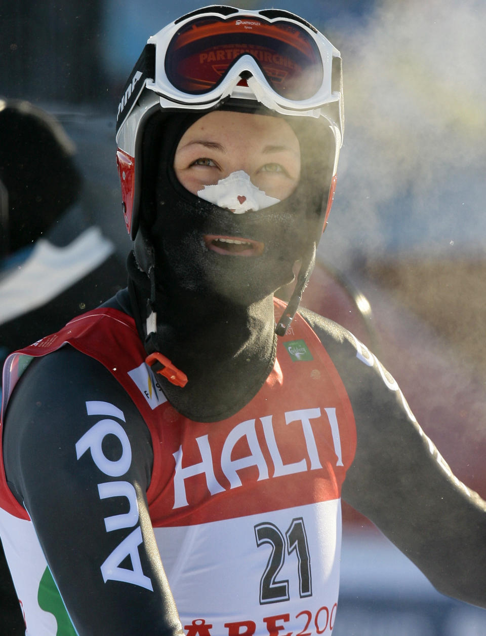 FILE - In this Feb. 9, 2007 file photo, Germany's Fanny Chmelar, wearing a face mask and tape to protect her face from the cold, looks at the scoreboard after completing the downhill portion of the Women's Combined, at the World Alpine Ski Championships in Are, Sweden. Even the world's top skiers can struggle to keep warm in extremely cold conditions, which will likely be a factor at the Alpine world championships opening in Are, Sweden, next week, from 5–17 February 2019. (AP Photo/Luca Bruno, file)
