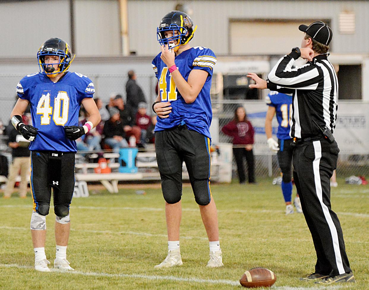 Castlewood's Booker Schooley (40) and Byron Laue (41) get ready for the next play during their Class 9A first-round win over Timber Lake in the state high school football playoffs on Thursday, Oct. 20, 2022. The Warriors visit Lyman in the second round on Thursday, Oct. 27.