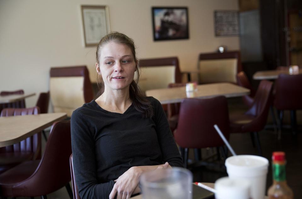 Ashley Chandler, 33, sits in the restaurant where she works as a waitress in Lula, Ga., in Hall County, Tuesday, Jan. 10, 2017. "They all make promises to get elected," said Chandler, explaining that her measure for President-elect Donald Trump is low: "Maybe he can make it less of a struggle" for people like her. (AP Photo/David Goldman)