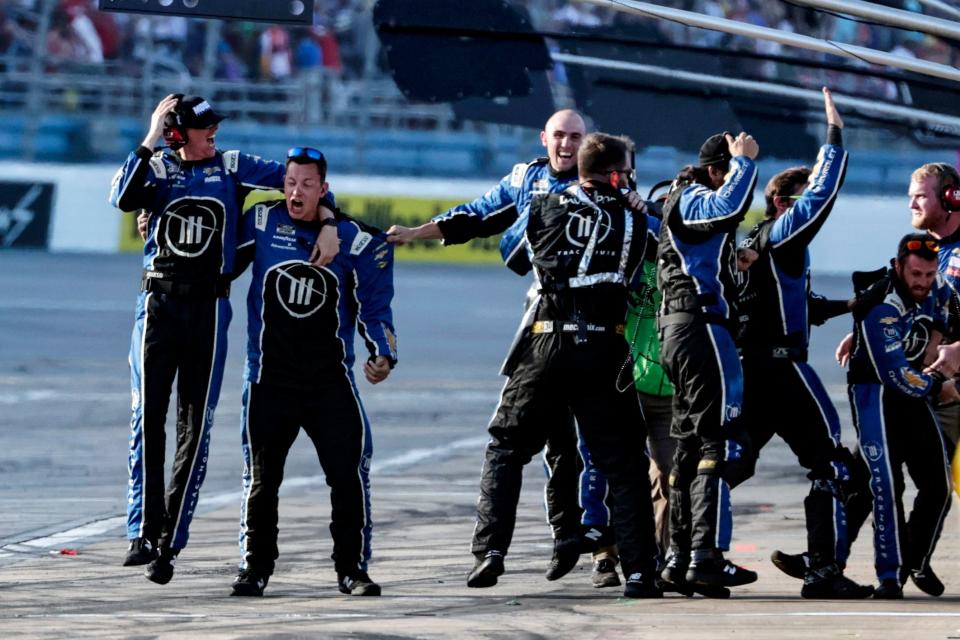 Crew members for NASCAR Cup Series driver Ross Chastain celebrate the win during the NASCAR Cup Series auto race, Sunday, April 24, 2022, in Talladega, Ala. (AP Photo/Butch Dill)