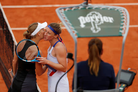 Tennis - French Open - Roland Garros, Paris, France - June 1, 2018 Denmark's Caroline Wozniacki kisses France's Pauline Parmentier after winning their third round match REUTERS/Gonzalo Fuentes