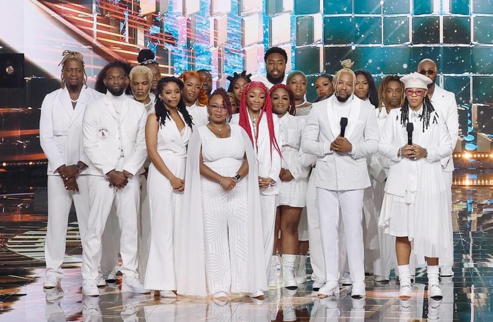 From the stage for “America’s Got Talent, Sainted Trap Choir’s DJ Fannie Mae stands far right, with a white beret, and Dennis Reed is next to her. They have big dreams for the group.