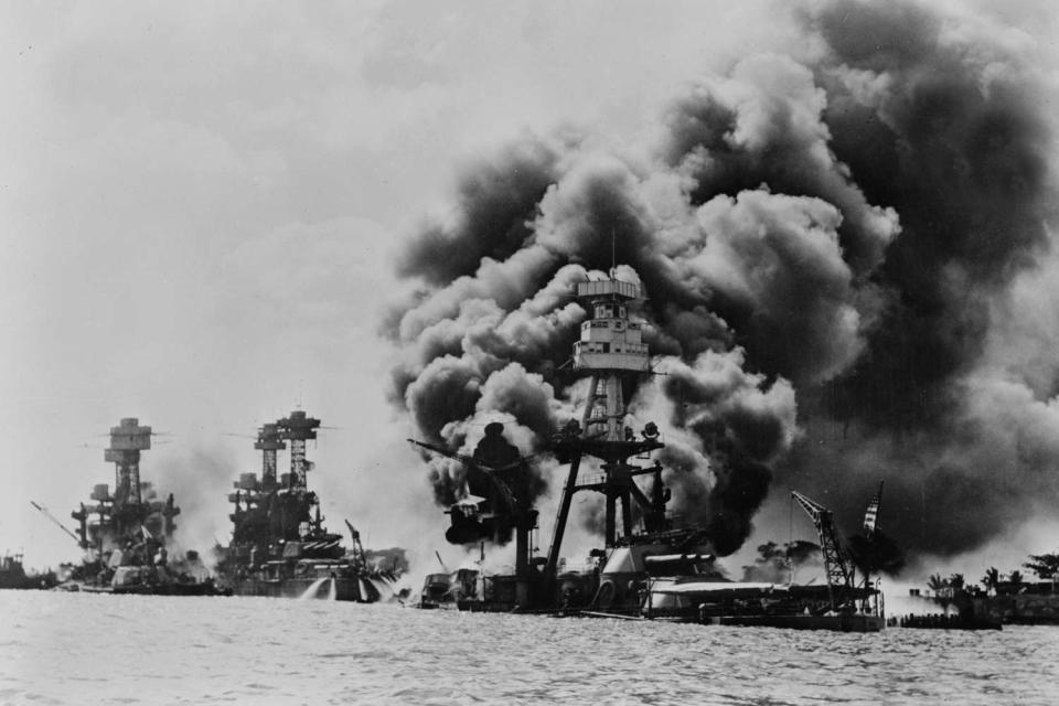 <p>Universal History Archive/UIG via Getty</p> Three stricken US battleships. Left to right, West Virginia, Tennessee and Arizona after the Japanese attack on Pearl Harbour in World War II, 1941. 