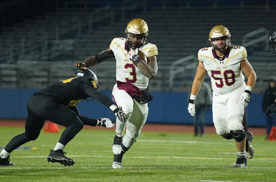 Iona Prep's Ajani Sheppard (3) looks to break a tackle during their 50-18 loss to St. Anthony's in the CHSFL AAA championship game at the Mitchel Athletic Complex in Uniondale on Saturday, November 19, 2022.