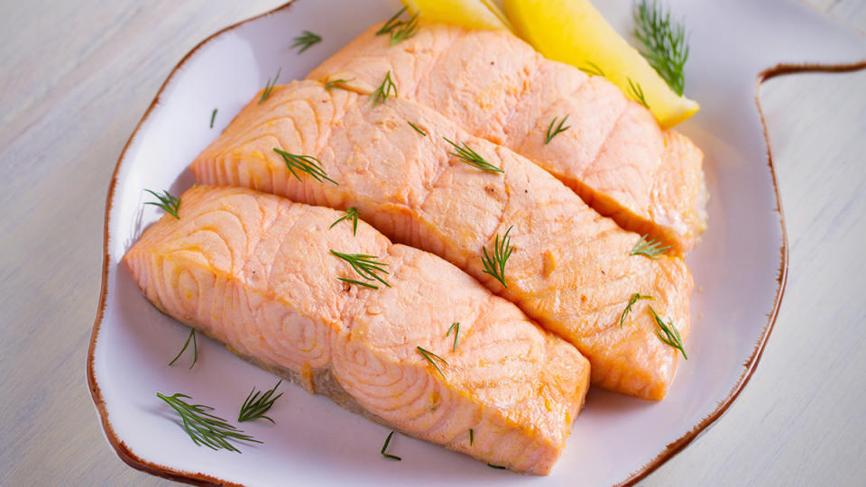 Microwave poached salmon on a fish-shaped white platter