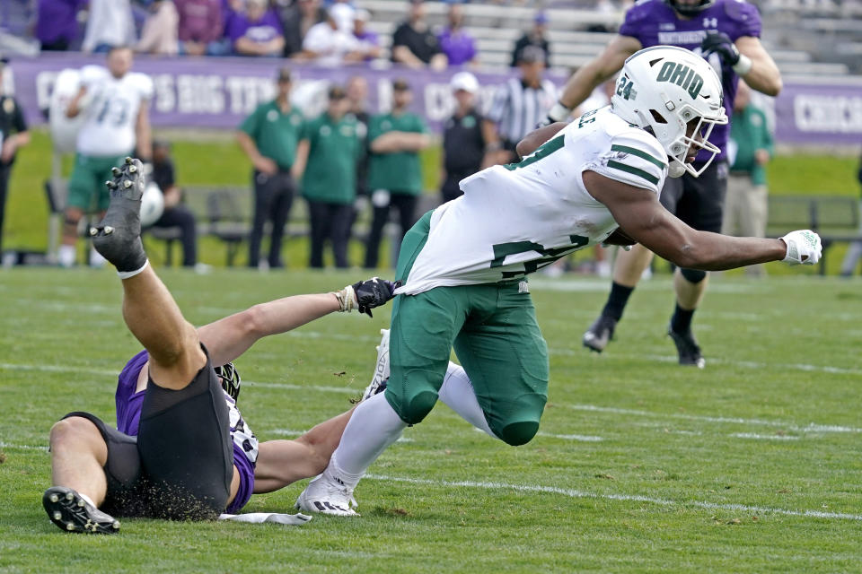 Ohio running back De'Montre Tuggle, right, is tackled by Northwestern linebacker Chris Bergin during the second half of an NCAA college football game in Evanston, Ill., Saturday, Sept. 25, 2021. Northwestern won 35-6. (AP Photo/Nam Y. Huh)