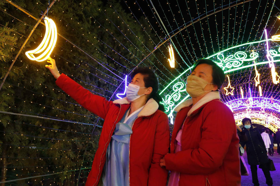 Citizens visit a light festival in celebration of 110th birth anniversary of their late leader Kim Il Sung at Kim Il Sung Square in Pyongyang, North Korea Thursday, April 14, 2022. (AP Photo/Jon Chol Jin)
