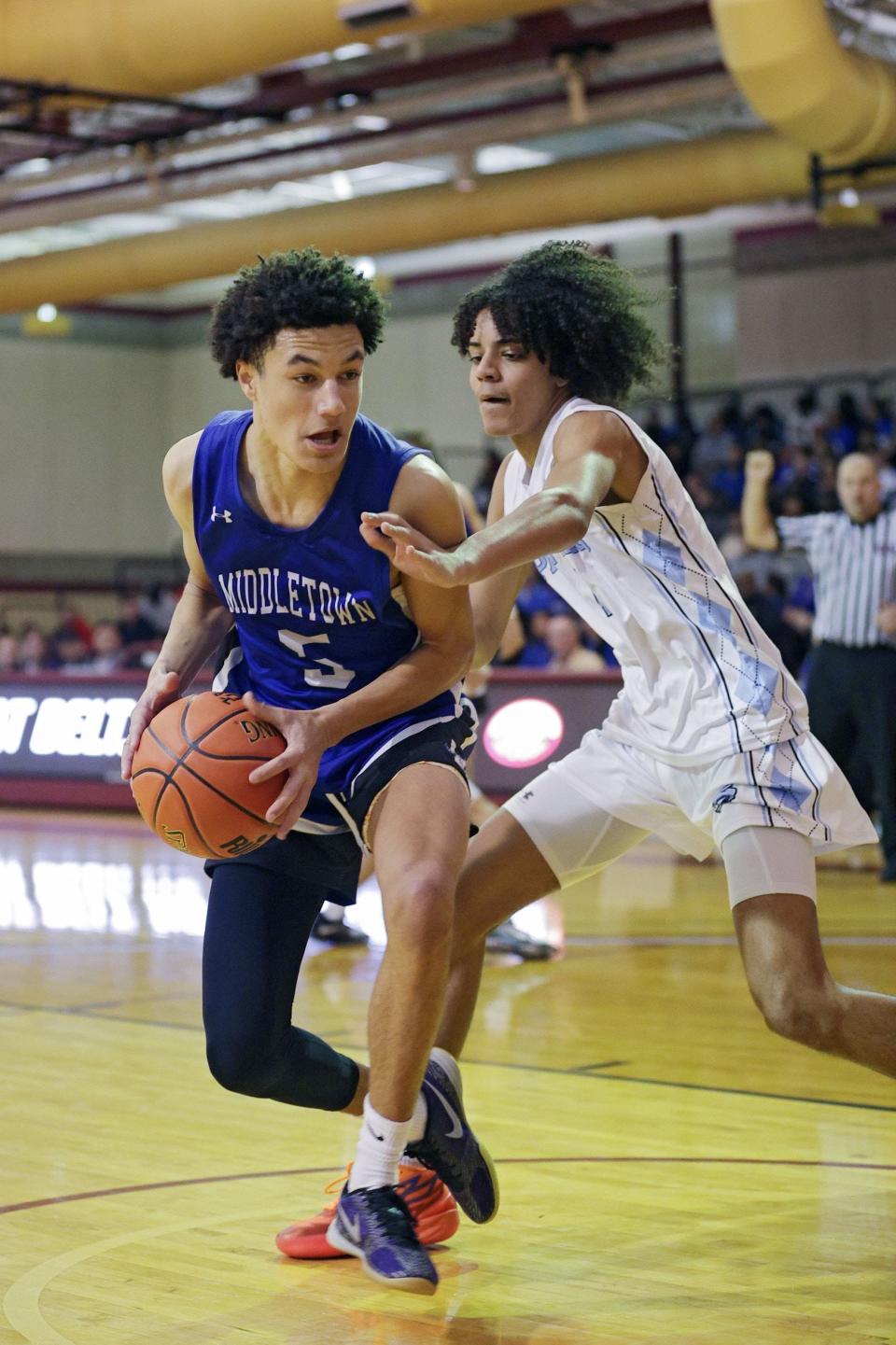 Middletown High School's RJ Wiggins (5), shown playing against Johnston, scored 20 points and grabbed six rebounds to help Middletown down Chariho 68-53 in an open state tournament Sweet 16 contest on Thursday.