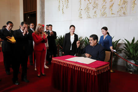 Venezuela's President Nicolas Maduro signs the guest book at the mausoleum of China's late Chairman Mao Zedong in Beijing, China September 14, 2018. Miraflores Palace/Handout via REUTERS