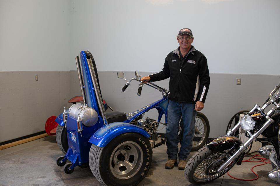 Steve VanderPol poses with the first vehicle his father, Gary VanderPol, built. Steve VanderPol remember riding on it for the first time while sitting on his father's lap as a child.