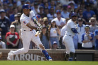 Chicago Cubs' Christopher Morel swings into a game-winning RBI single off Pittsburgh Pirates pitcher David Bednar in the ninth inning of a baseball game Saturday, May 18, 2024, in Chicago. The Cubs' Cody Bellinger scored for a 1-0 win. (AP Photo/Charles Rex Arbogast)