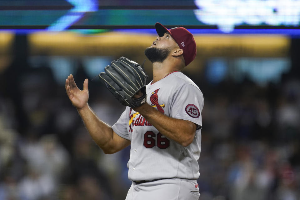 St. Louis Cardinals relief pitcher Luis Garcia (66) reacts after Los Angeles Dodgers' Mookie Betts flies out to end the seventh inning of a National League Wild Card playoff baseball game Wednesday, Oct. 6, 2021, in Los Angeles. (AP Photo/Marcio Jose Sanchez)