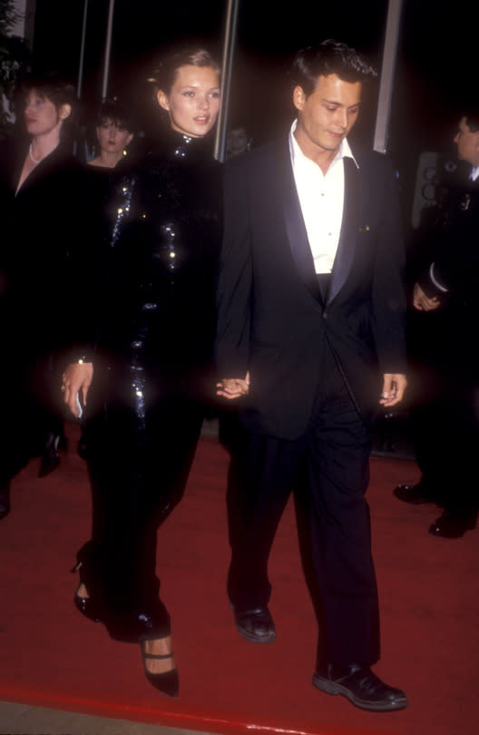 <p>Even when she was younger, Kate Moss knew how to command a red carpet. At the height of her ’90s heyday, she wore a vintage dress to the Globes that was purchased by her then boyfriend, Johnny Depp. The full-length sequined ensemble was originally worn by Julie Christie in <i>Shampoo,</i> making everything about her even more impossibly cool.<br></p><p><i><i>(Photo: Getty Images) </i></i></p>