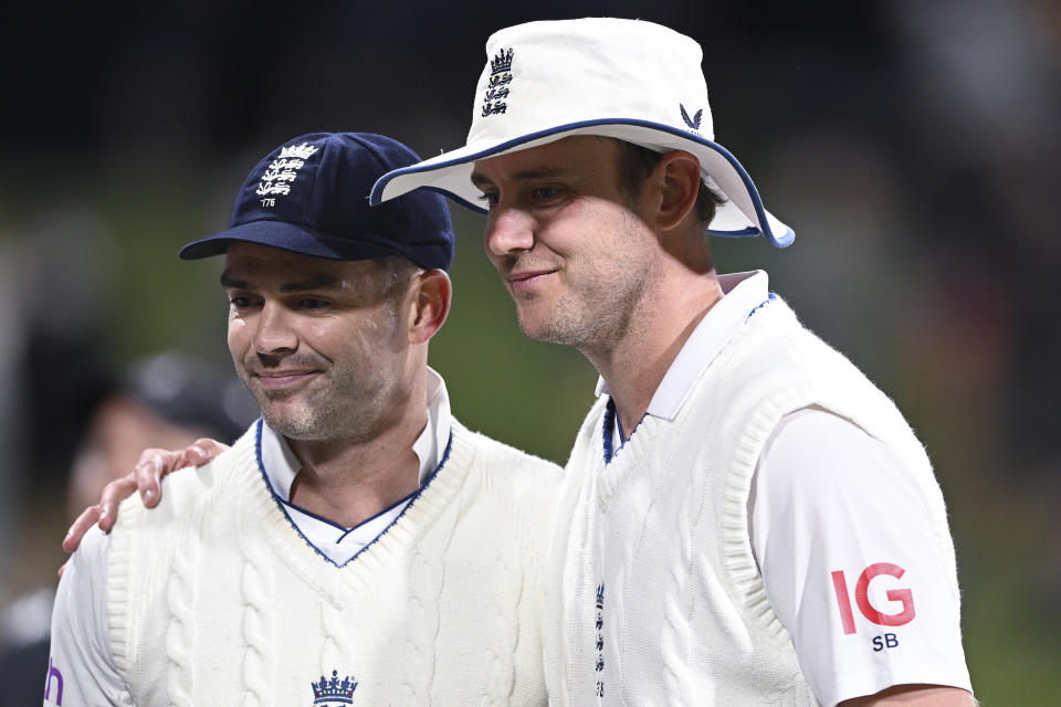 England's England's James Anderson, left, and Stuart Broad pose for a photo at stumps on the third day of their cricket test match against New Zealand in Tauranga, New Zealand, Saturday, Feb. 18, 2023. (Andrew Cornaga/Photosport via AP)